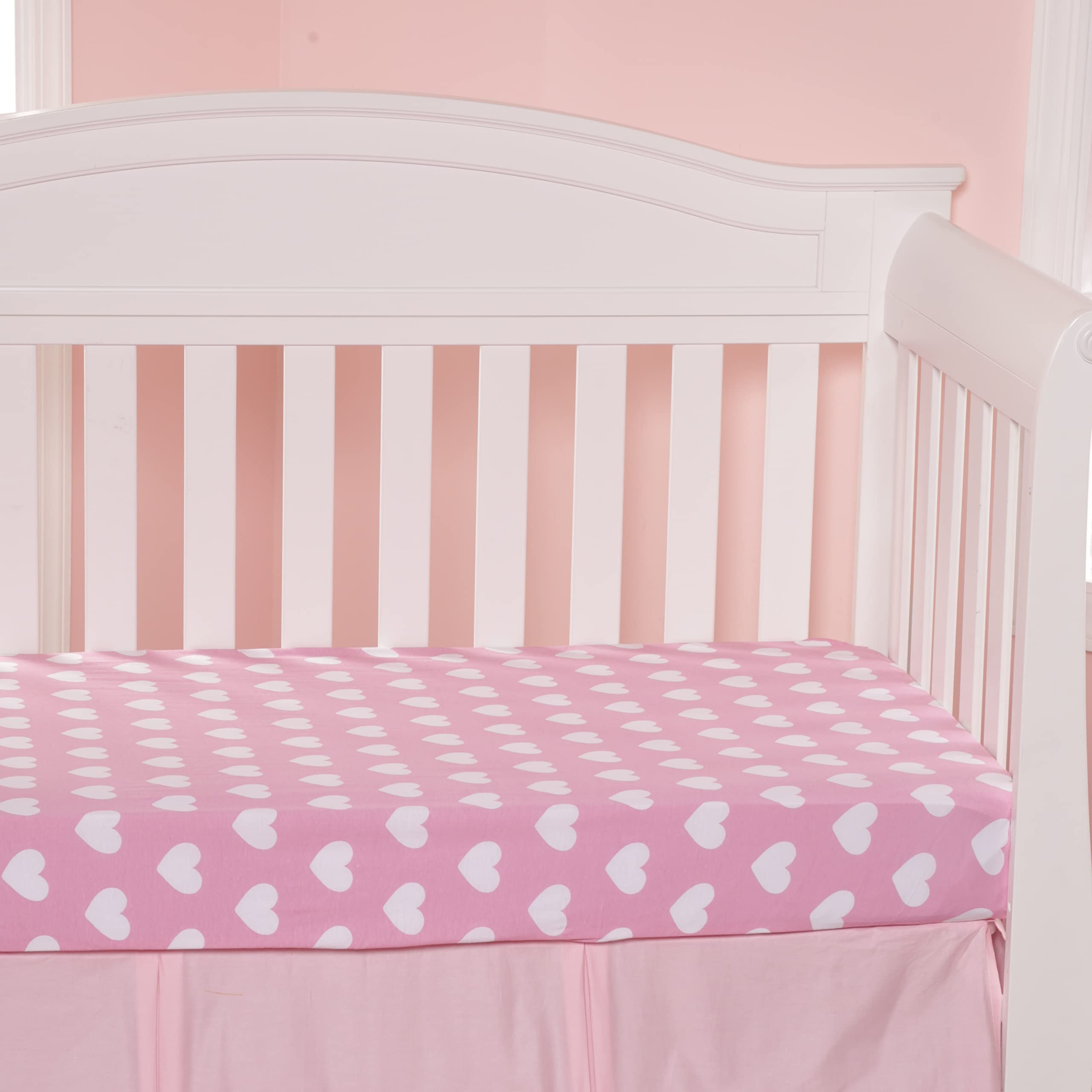 Everyday Kids folded sheets in a bright nursery demonstrate easy swaps