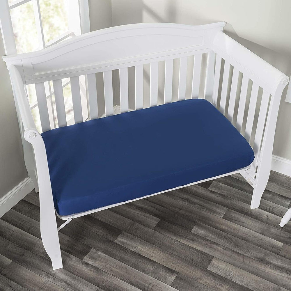 Everyday Kids gray crib sheet folded illustrates breathable microfiber and cozy nap-time comfort.