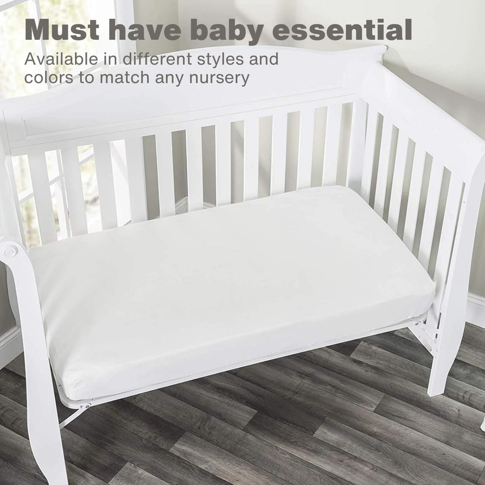Everyday Kids navy sheet folded to illustrate snug crib fit.