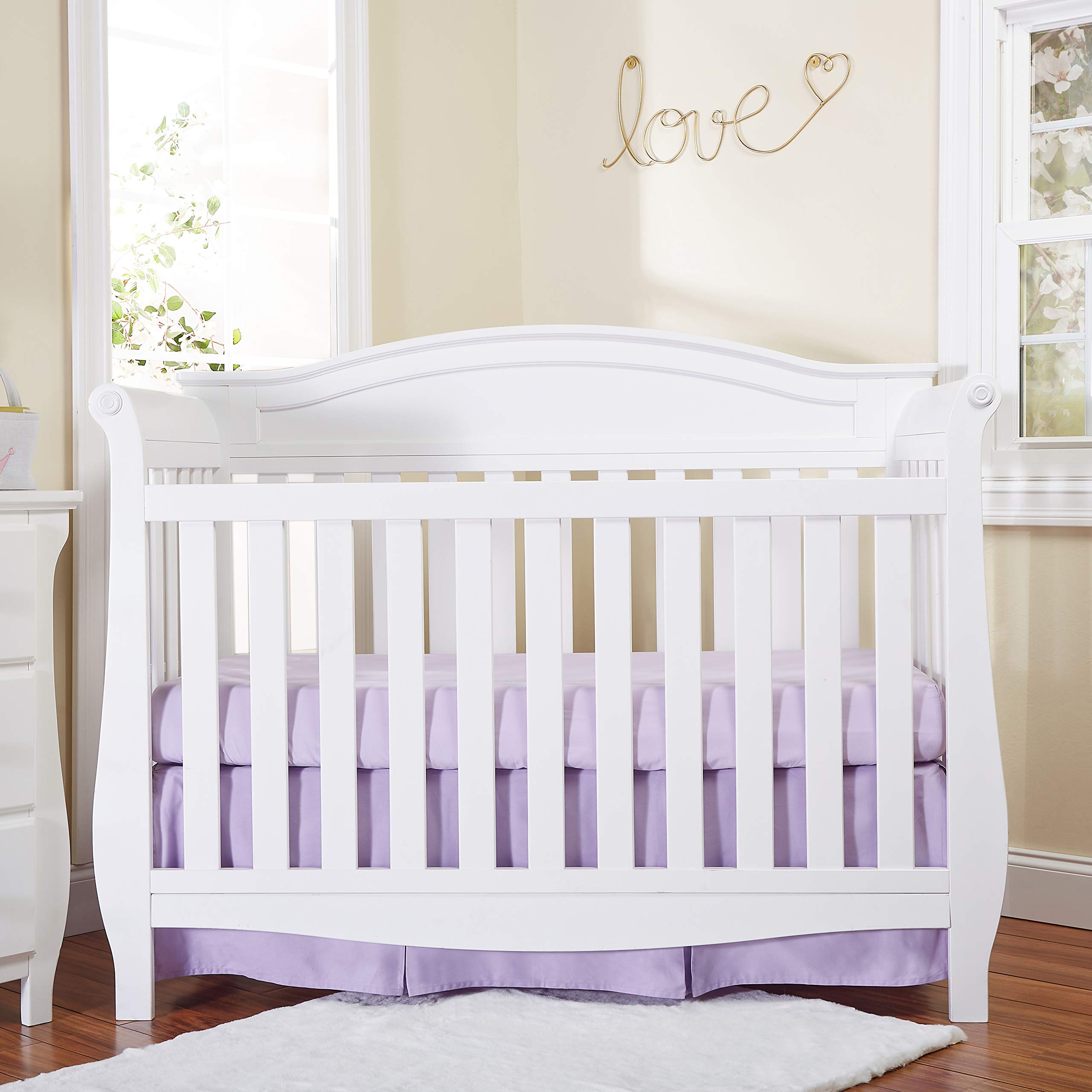EVERYDAY KIDS pleated crib skirt side view highlights a 14-inch drop and hidden storage.