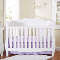 EVERYDAY KIDS pleated crib skirt side view highlights a 14-inch drop and hidden storage.