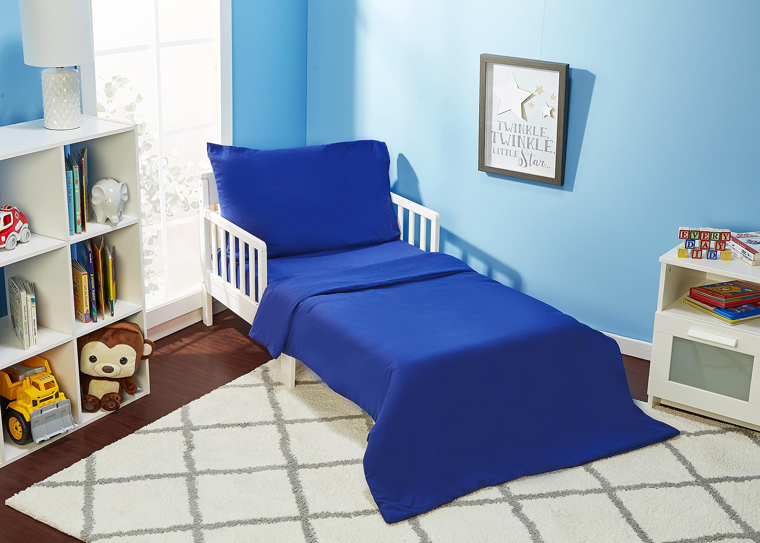 Everyday Kids solid navy comforter image shows cozy bedtime feel