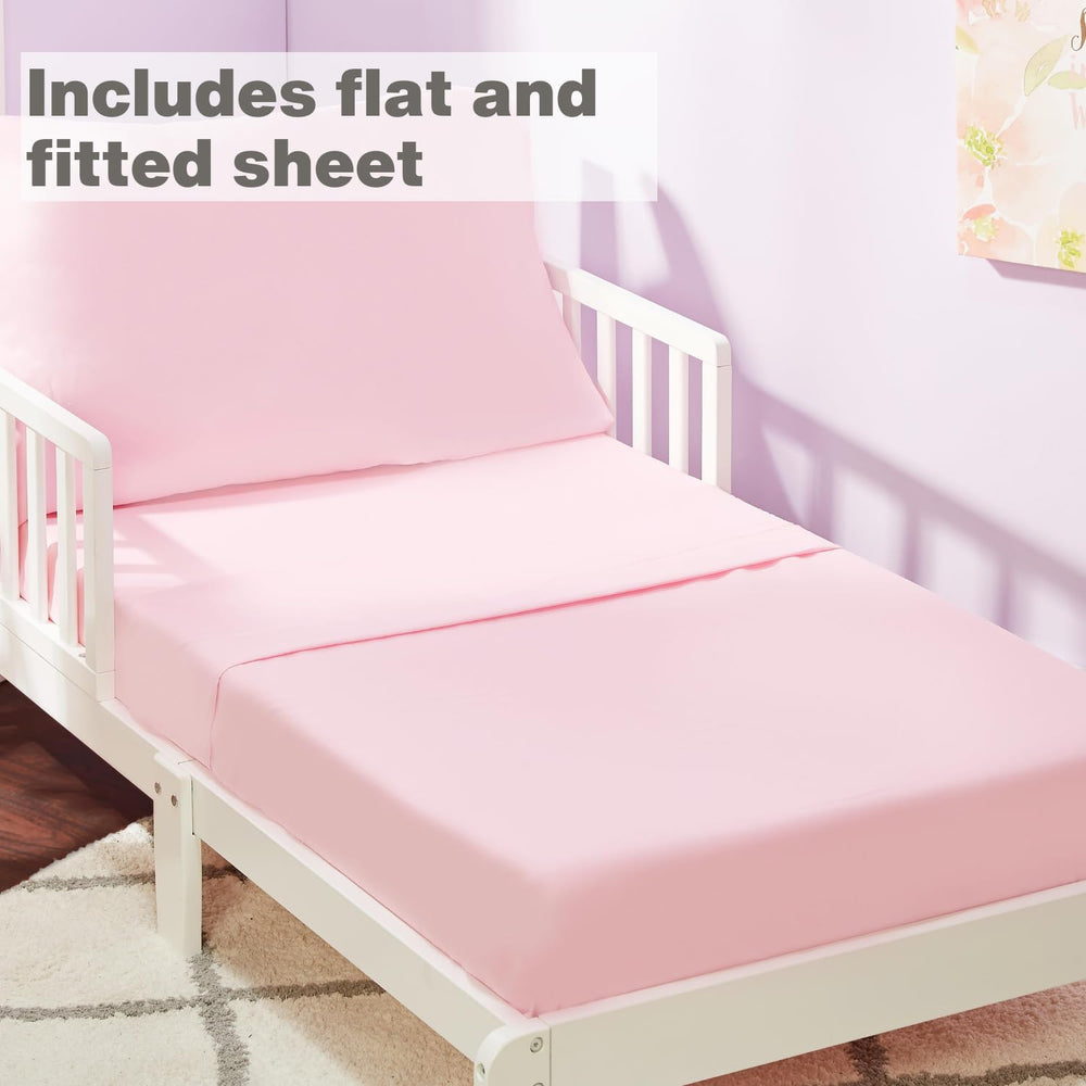 EVERYDAY KIDS solid pink fitted sheet demonstrates snug toddler mattress fit with durable elastic