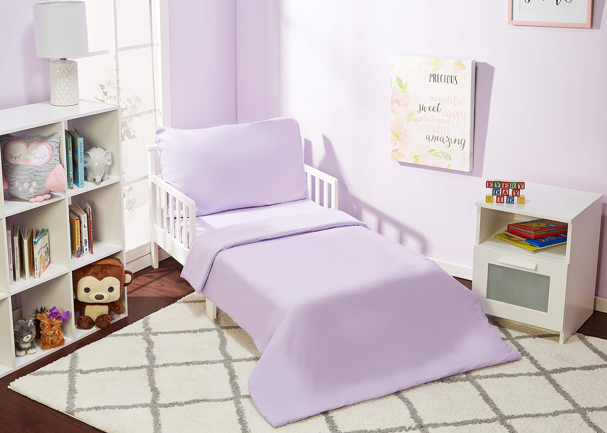 Everyday Kids solid purple comforter closeup shows cozy brushed microfiber softness for kid-friendly sleep.