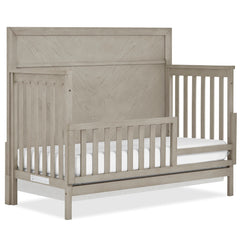 Evolur Lourdes guard rail on Porcini crib offers easy assembly for a secure toddler transition