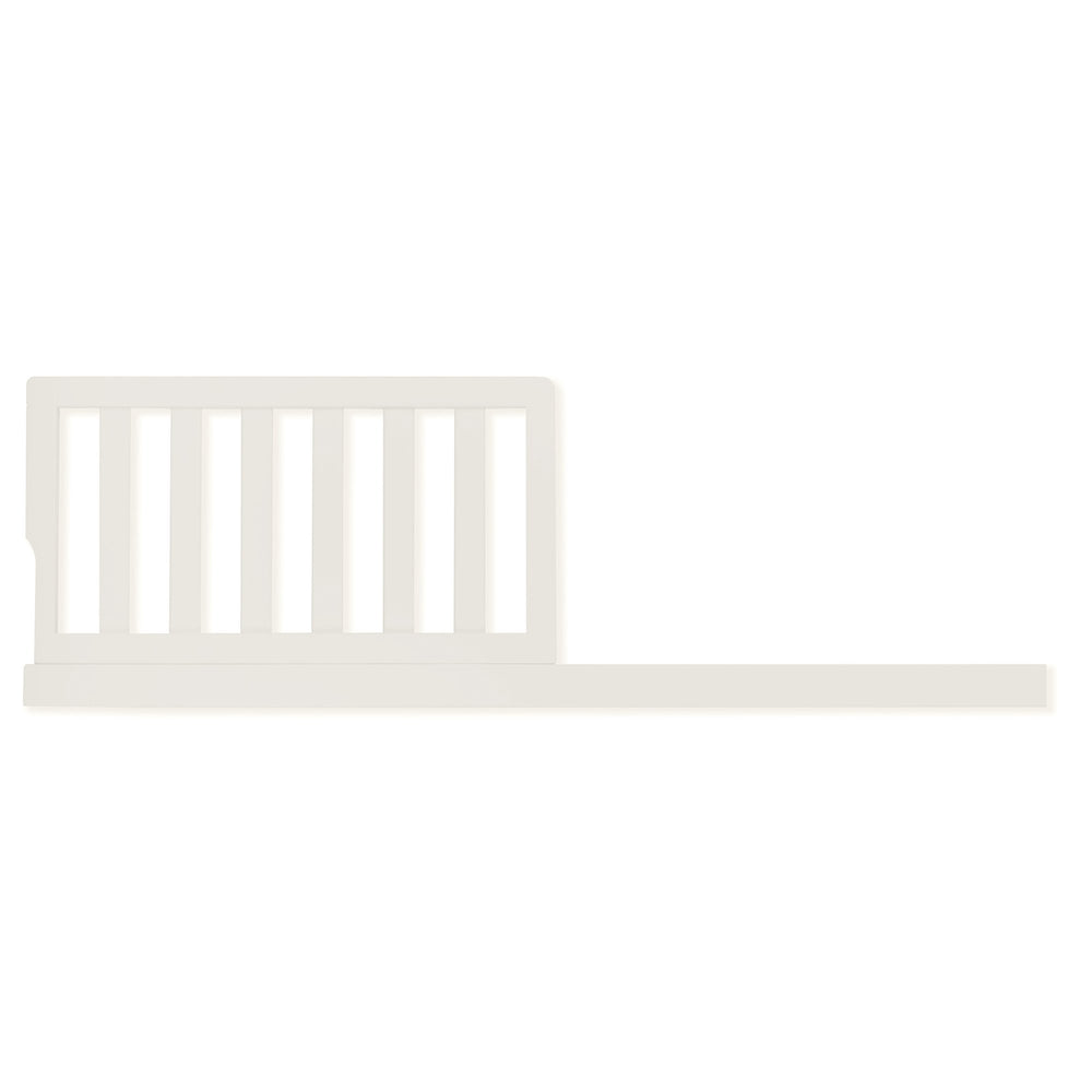 Evolur Toddler Guard Rail Ivory Lace attached to crib provides secure space during crib-to-bed transition.