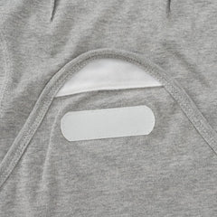 Exemaba hook-and-loop tabs secure inner cloth for easy, snug swaddling.