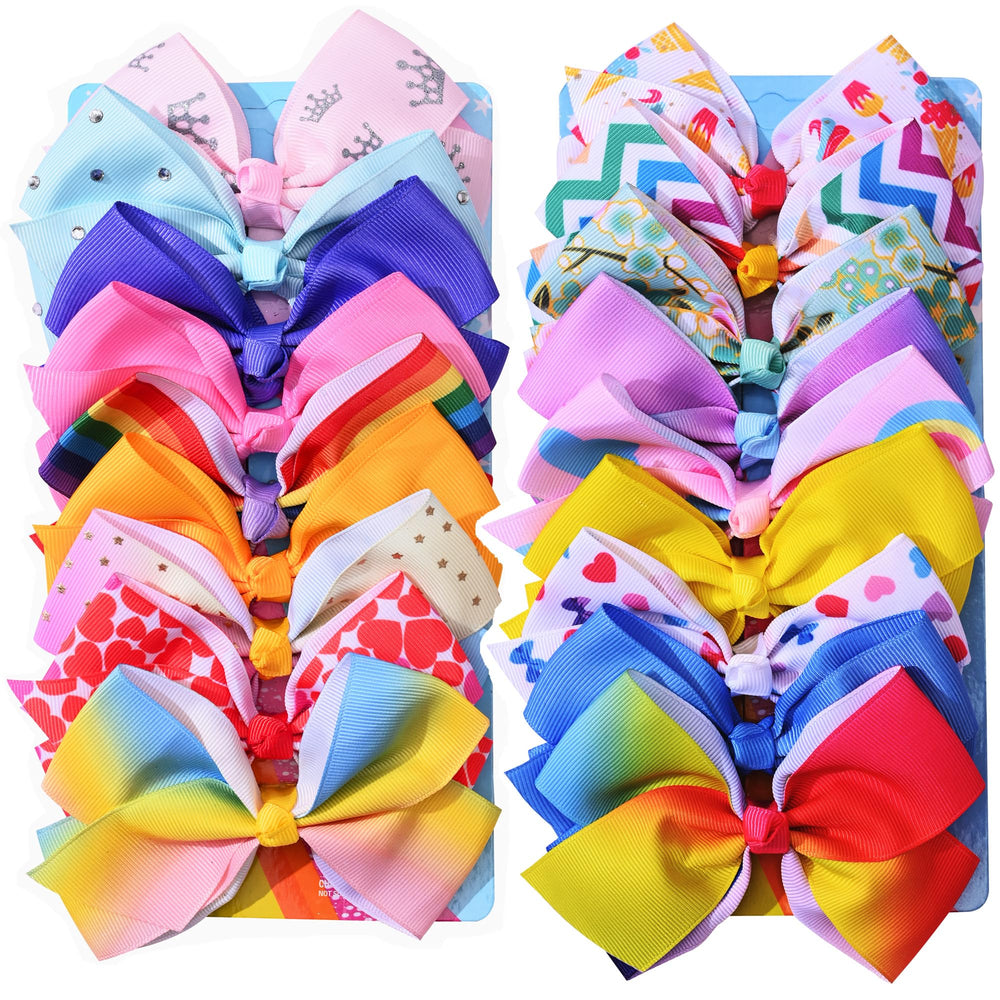 Eyegla rainbow grosgrain bows pack shown on fabric, adds vibrant color to everyday outfits.