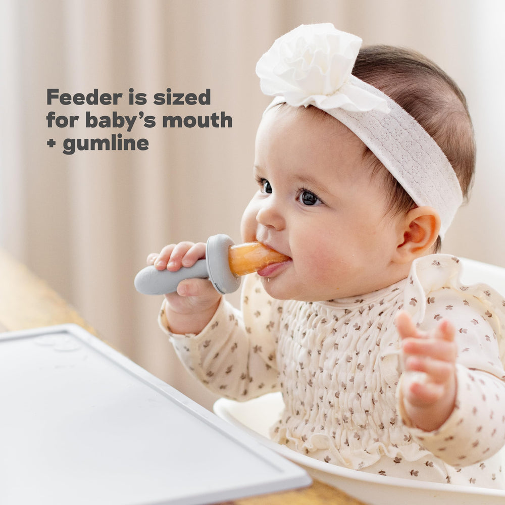 ezpz Baby-Led Gumline Feeder Sage serving soft fruit strips for self-feeding