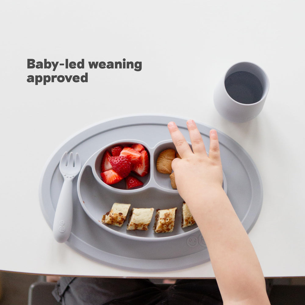 ezpz Mini Mat Coral on table for easy access during mealtime