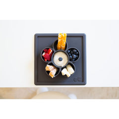 ezpz Mini Play Mat slate compartments help organize snacks and small crafts.