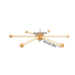 Faddare square style wooden mobile hanger offers contemporary look for tidy nurseries.