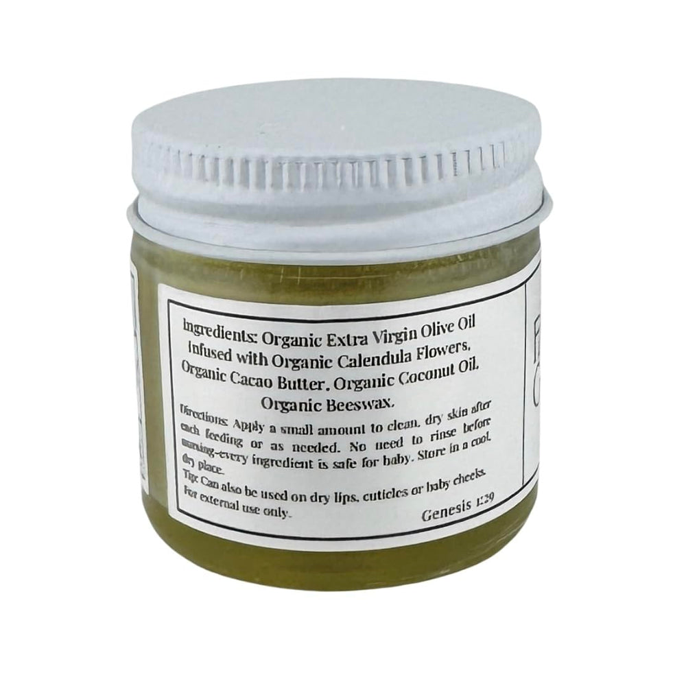 Faith and Grace Organics Nourish Nipple Balm being applied to skin for soothing touch.
