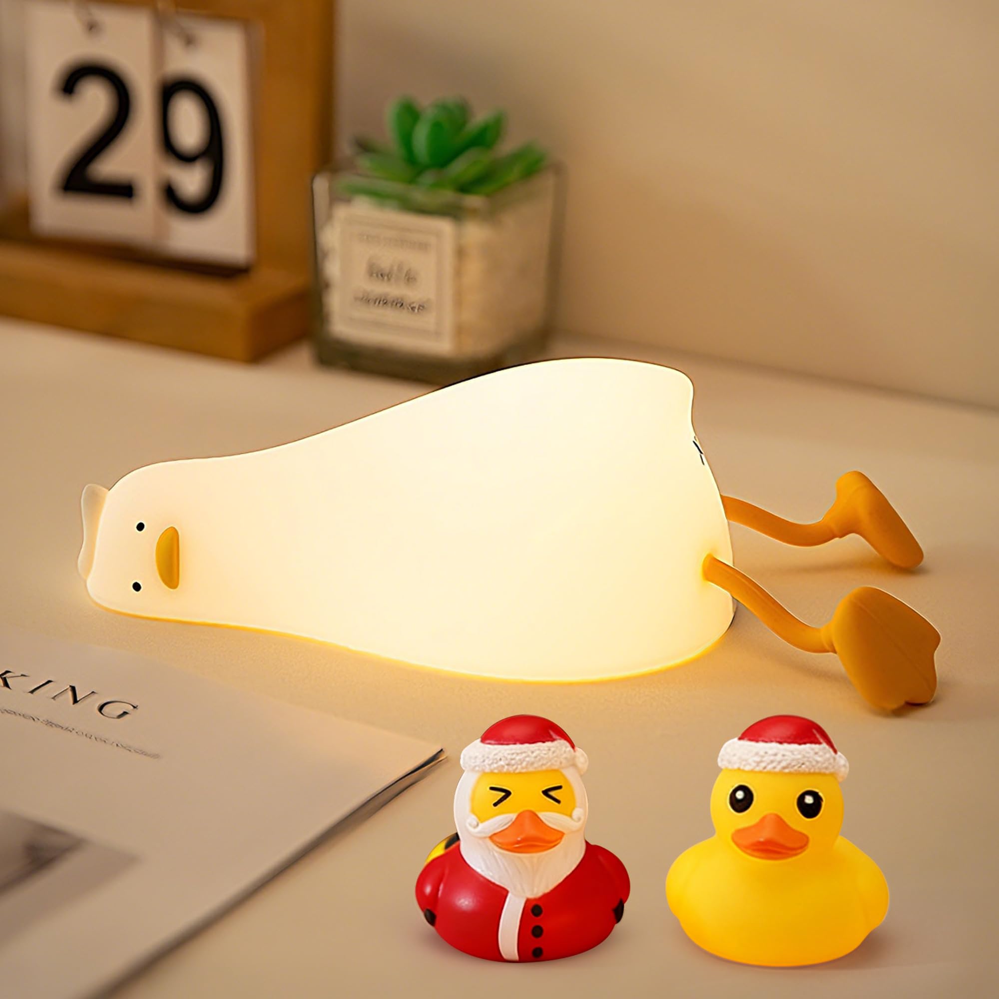FAMIDUO lying-flat-duck-night-light glows softly for bedtime reading and cozy ambience.