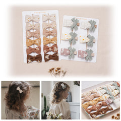 Fancy Clouds baby girl daisy-embroidered bows—secure clips for active days