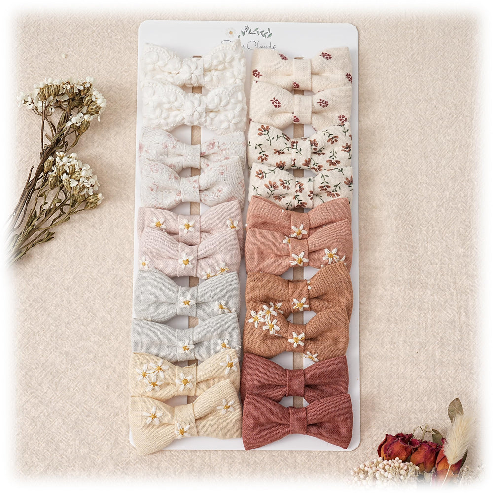 Fancy Clouds baby hair clips with handmade wrapping present a gift-ready look.