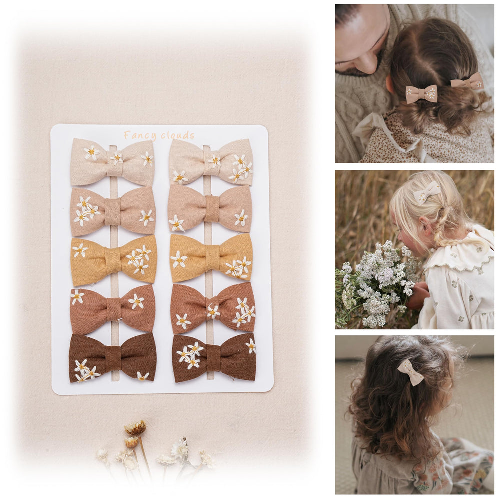 Fancy Clouds daisy display-card hair clips show secure wrap and color variety.