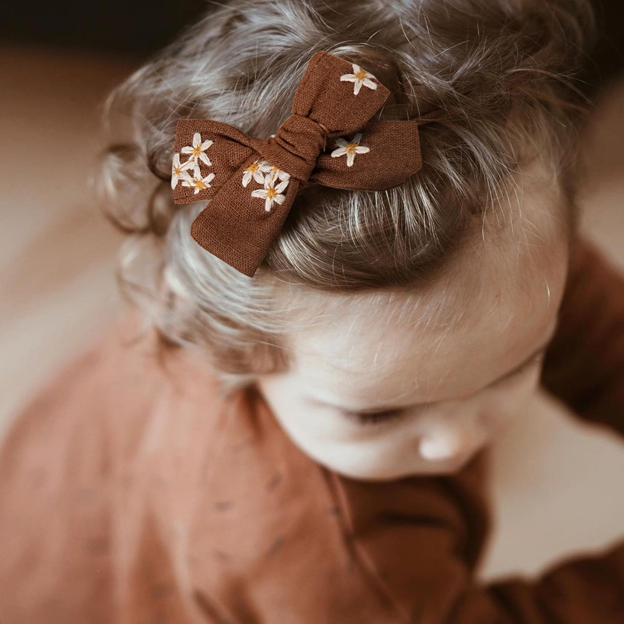 Fancy Clouds close-up shows secure, stretchable headbands for active babies.