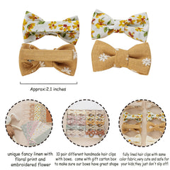 Fancy Clouds linen bows with embroidered flower add soft texture and charm.