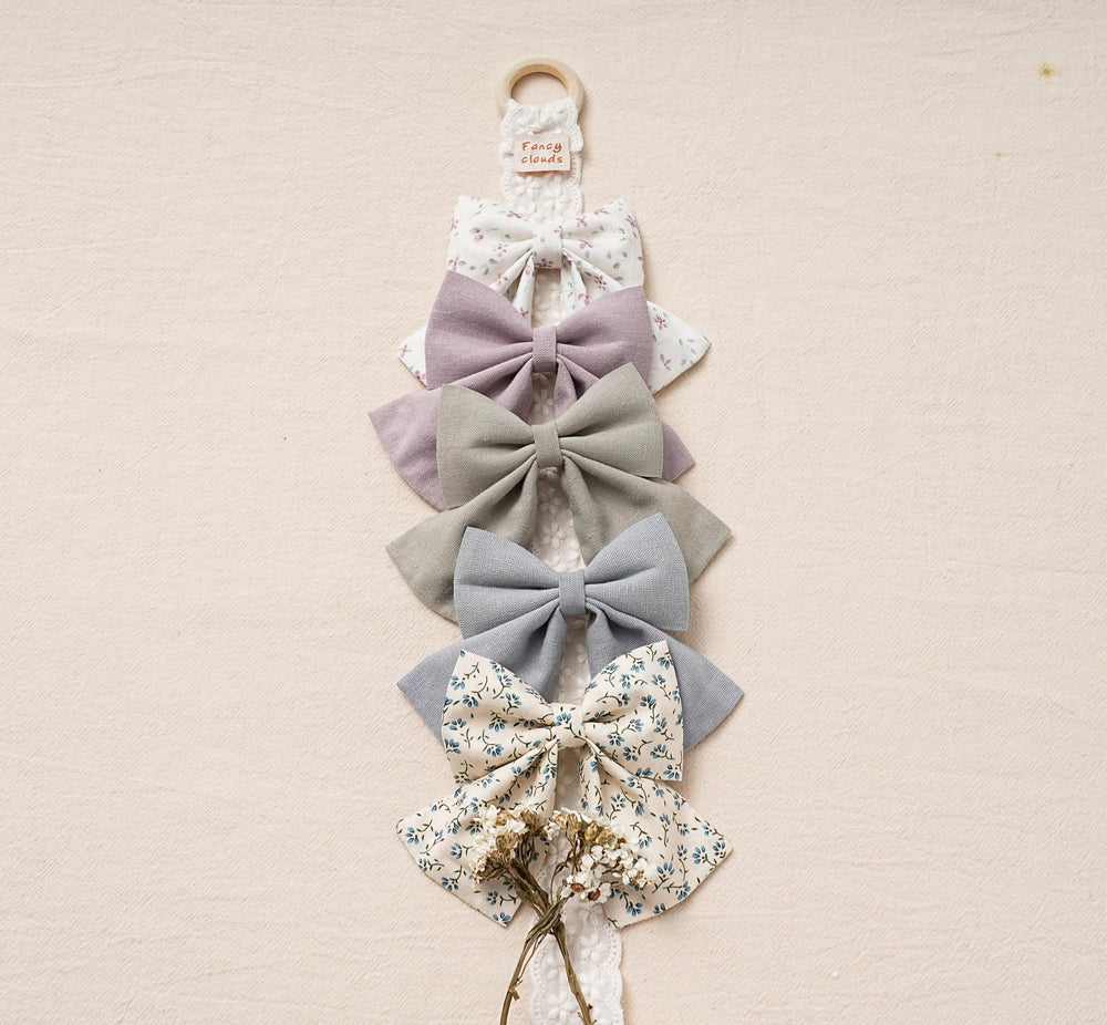 Fancy Clouds colorful bow collection demonstrates versatile colors for various hairstyles