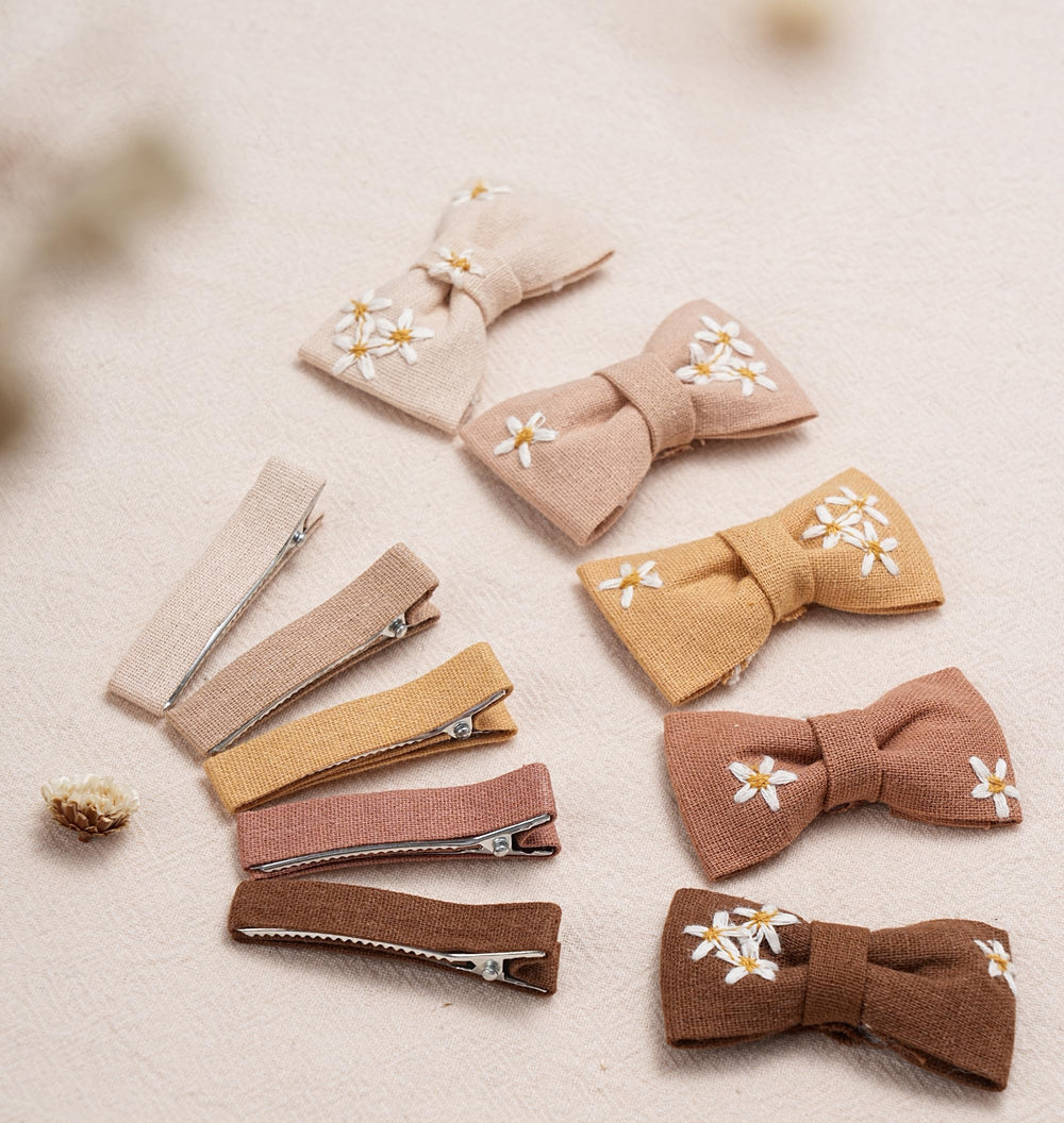 Fancy Clouds daisy bows color palette arranged for versatile outfits.