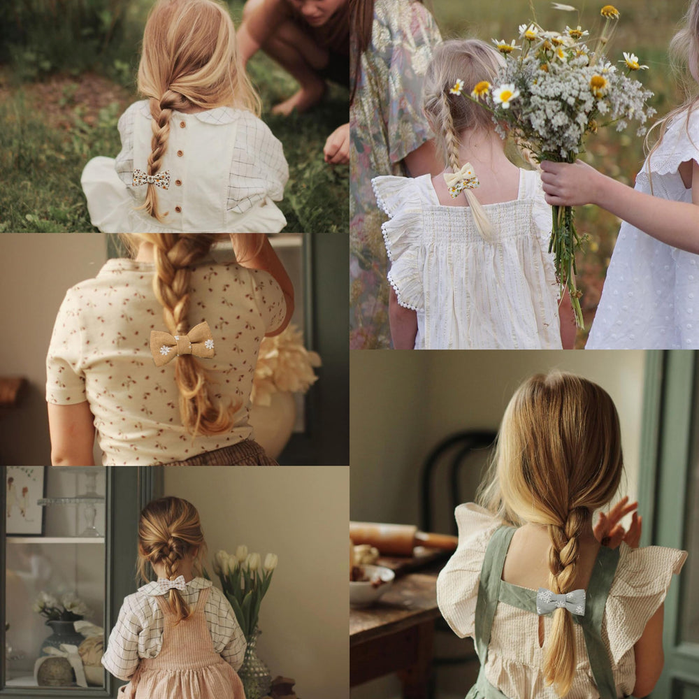 Fancy Clouds embroidered flower linen bow close-up, delicate detail for toddler hairstyles.