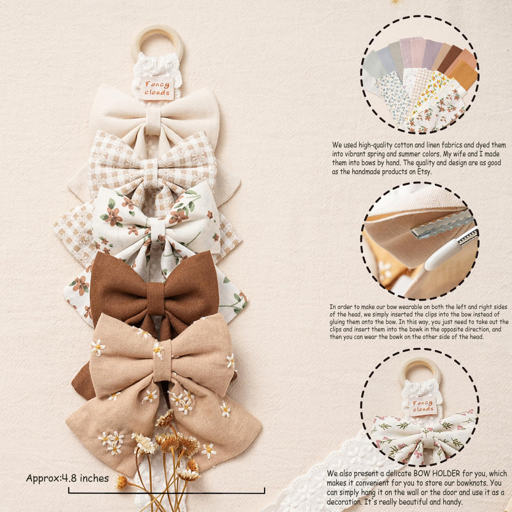 Fancy Clouds embroidery detail bows highlight delicate stitching for a charming girls' look.