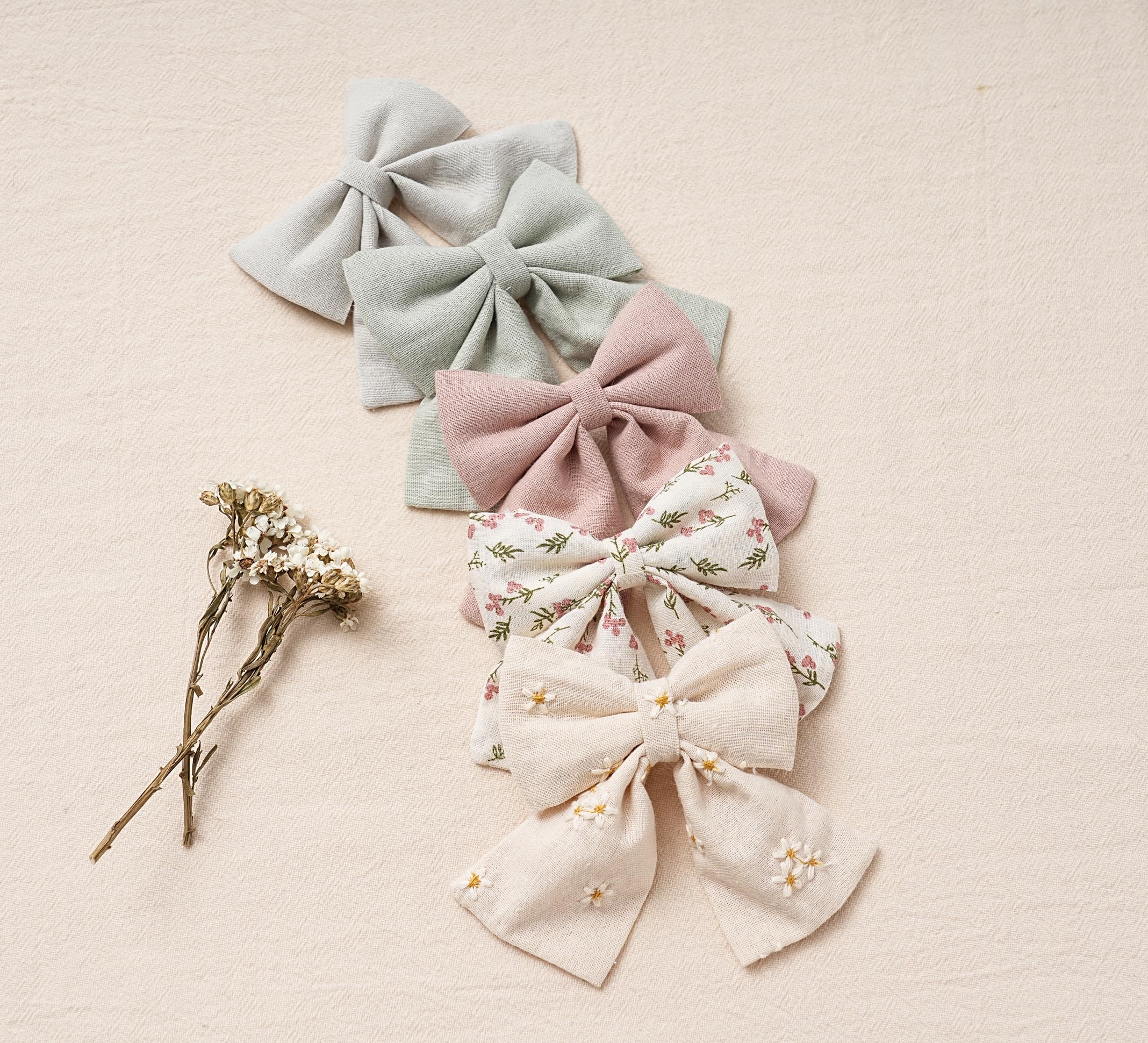 Fancy Clouds handmade embroidery bow highlights craftsmanship and flower print.