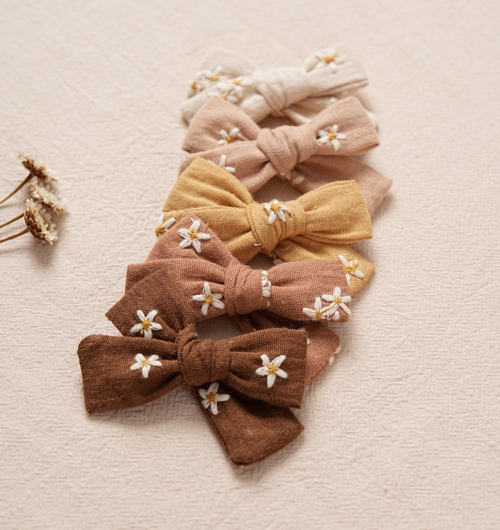 Fancy Clouds newborn friendly bows comfortable for all-day wear.