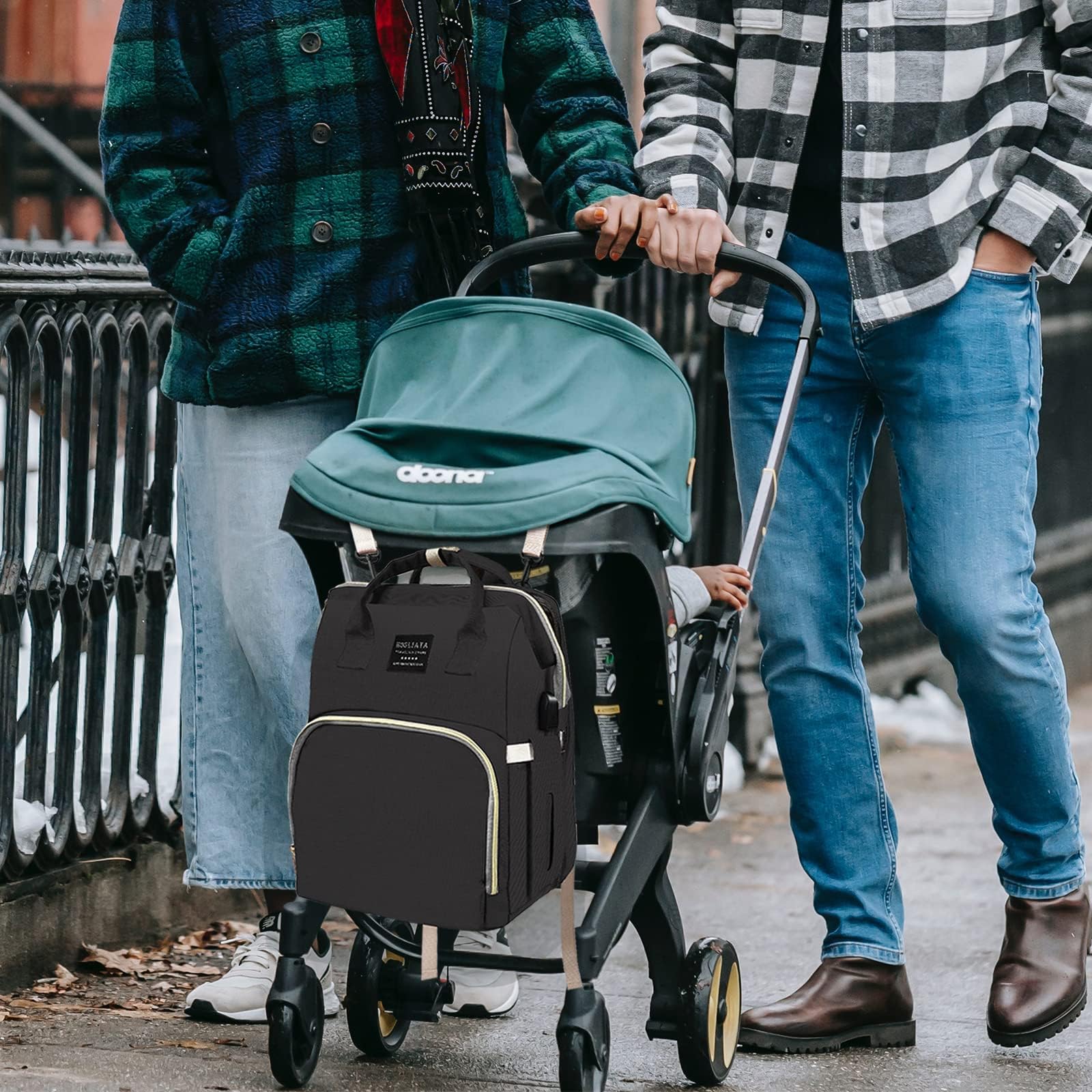Fandiar diaper bag in use with baby essentials during travel
