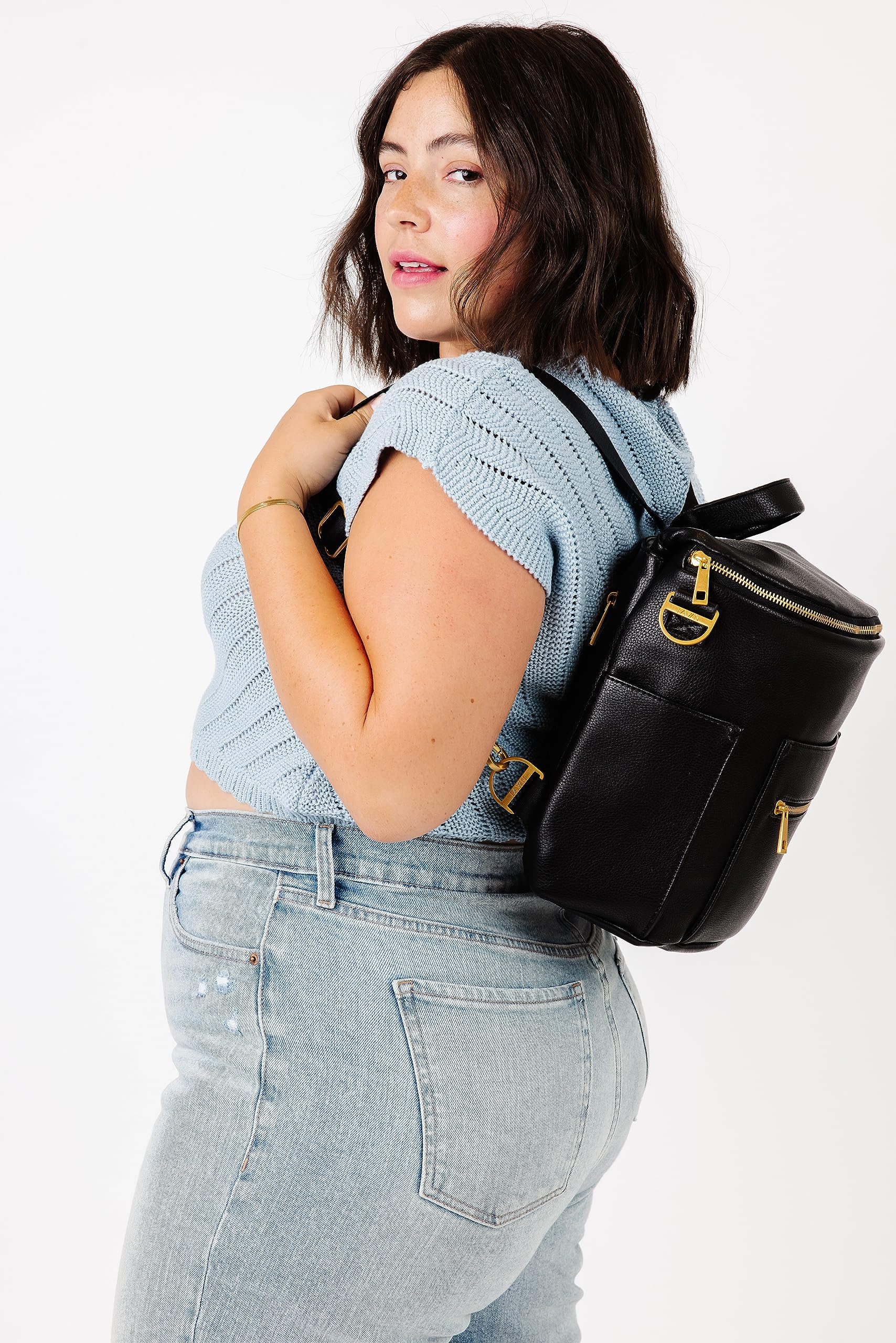 FAWN DESIGN Mini Diaper Bag convertible straps offer hands-free comfort on walks.