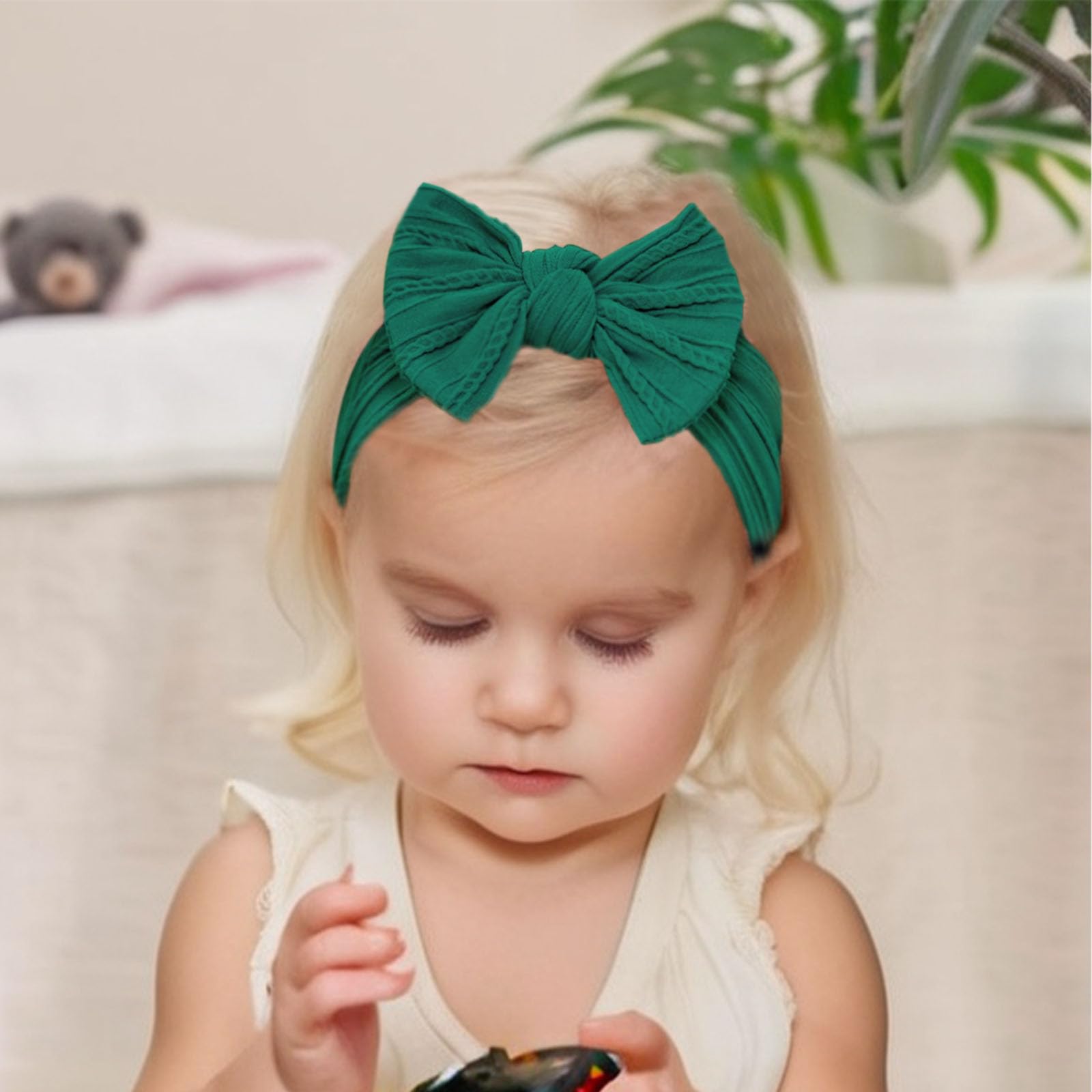 Fecawd headbands with wide band stay in place on active babies