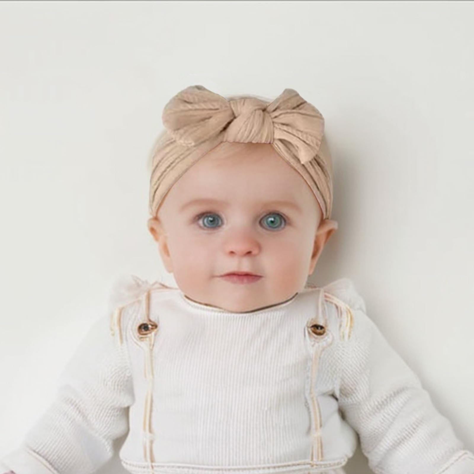 Fecawd headband bows with soft nylon and cable-knit texture for gentle wear.