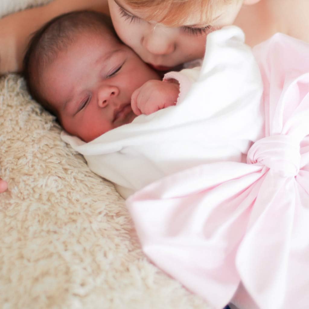 Fibroxify swaddle pink displayed on a wreath for styling