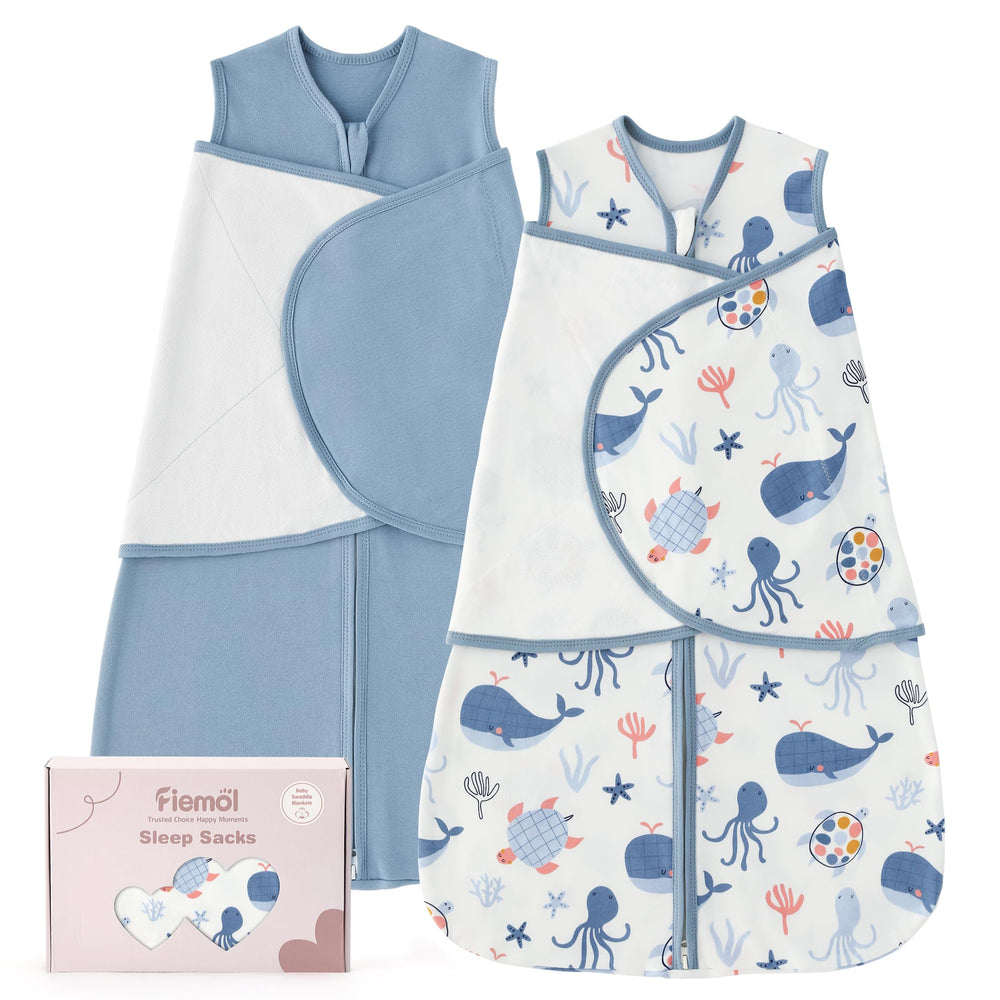 FIEMOL Baby Swaddle Sleep Sack blue whale design promotes calm sleep with breathable cotton.
