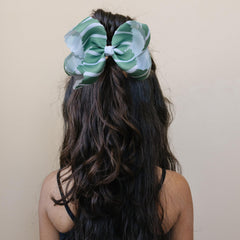 Fifi & Ry baby peach bow highlighting delicate look and gentle hold for fine hair