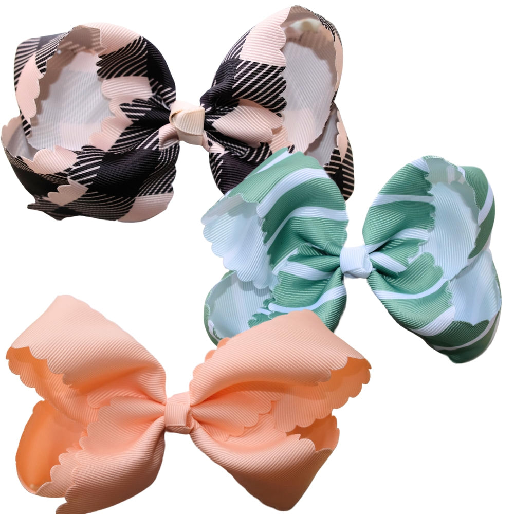Fifi & Ry premium bow in green stripes showing secure five-inch fit for active toddlers