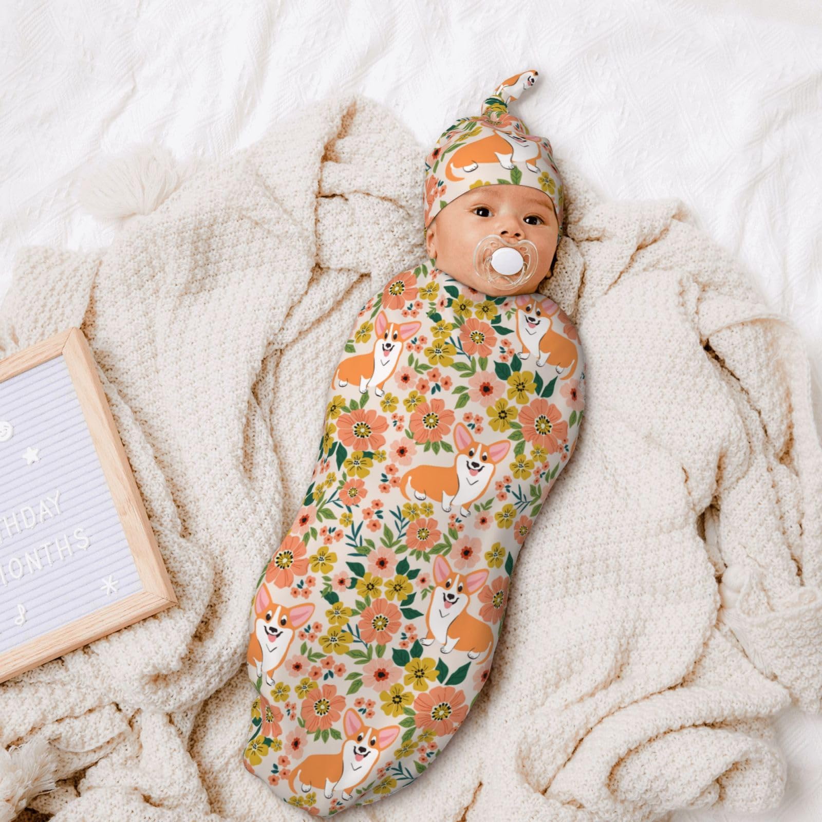 Figtihw dog-pattern swaddle blanket on a unisex baby design