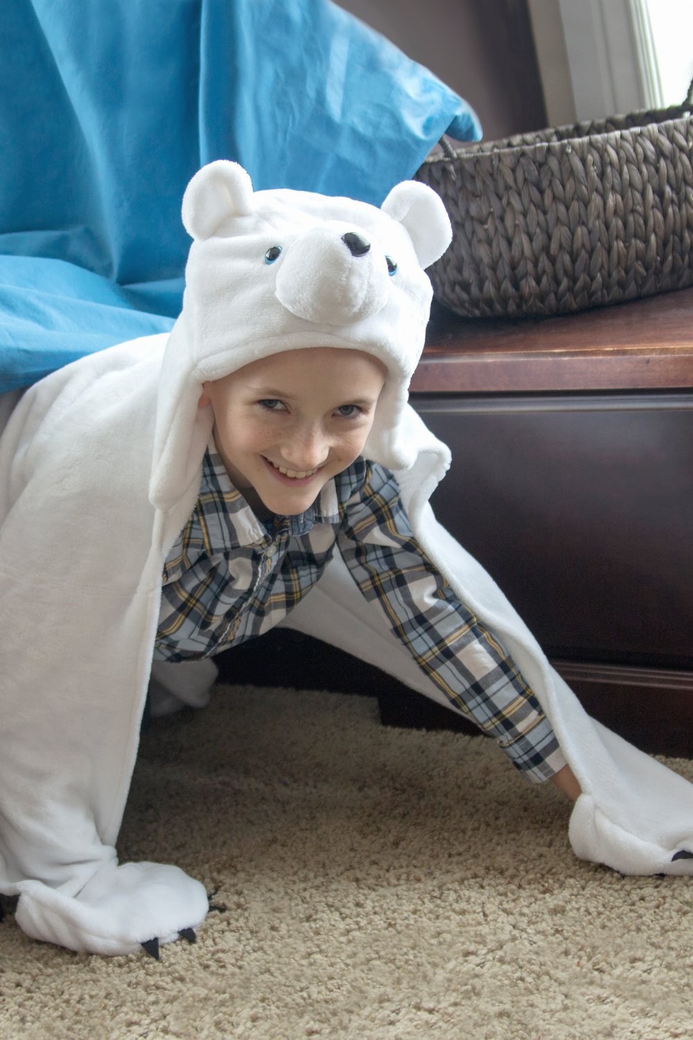 Fin Fun Polar Bear hooded blanket embroidery detail with colorful paw pockets.