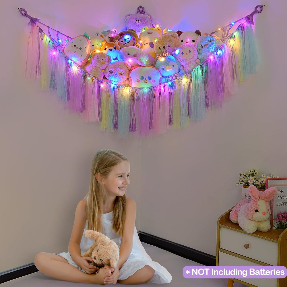 FIOBEE hanging stuffed animals hammock shown in a wide room shot for display.
