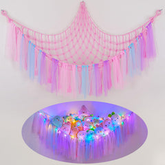FIOBEE stuffed animals hammock mounted in a corner for tidy nursery storage.