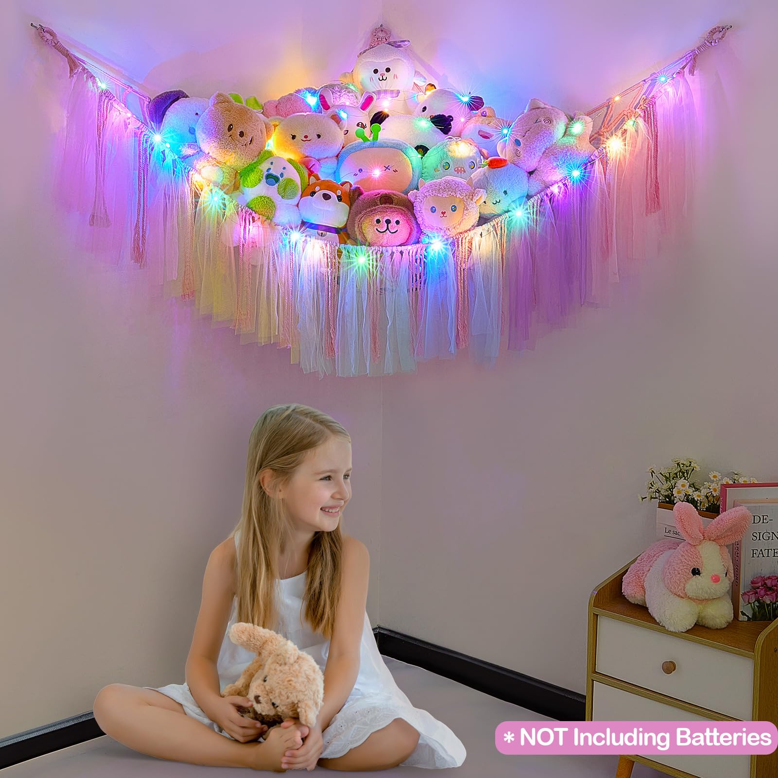 FIOBEE wall-hanging net keeps plush toys off floors for a tidy play area.