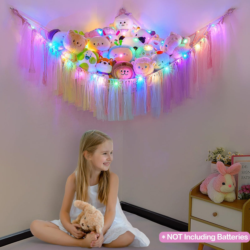 FIOBEE wall-hanging net keeps plush toys off floors for a tidy play area.