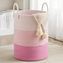 Fiona's magic pink standing cotton rope laundry hamper provides tall storage for clothes and blankets.