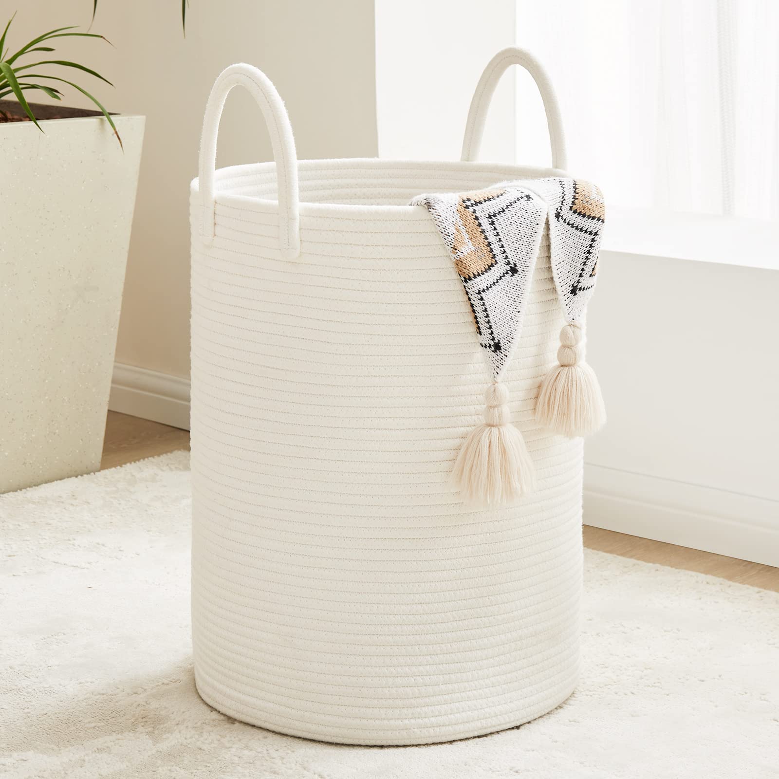 Fiona's magic white woven rope laundry basket 58L tall stores blankets and clothes with easy access.
