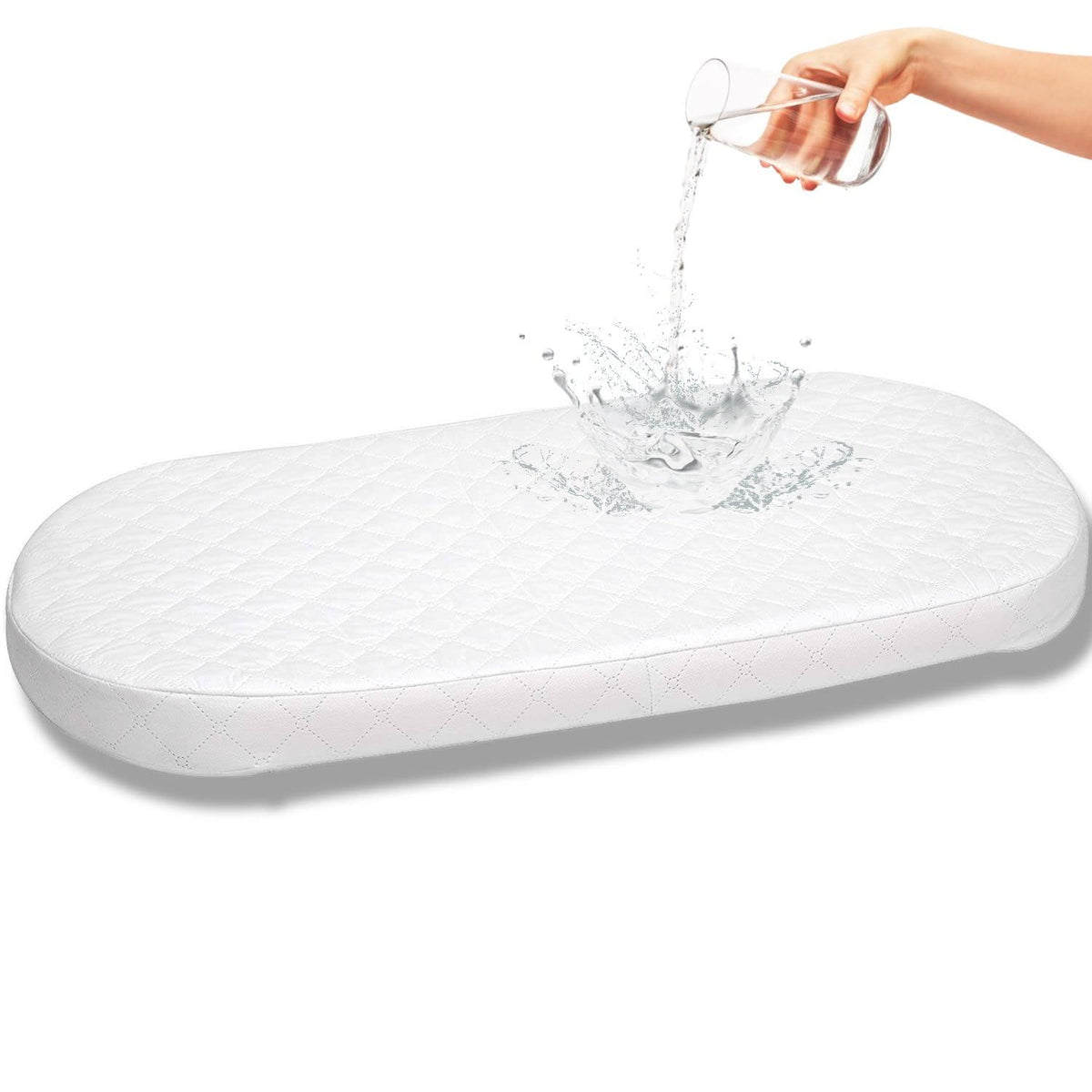 First Essentials bassinet pad foam close-up showing cloud-like comfort for newborn sleep.