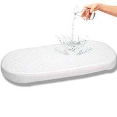 First Essentials bassinet pad foam close-up showing cloud-like comfort for newborn sleep.