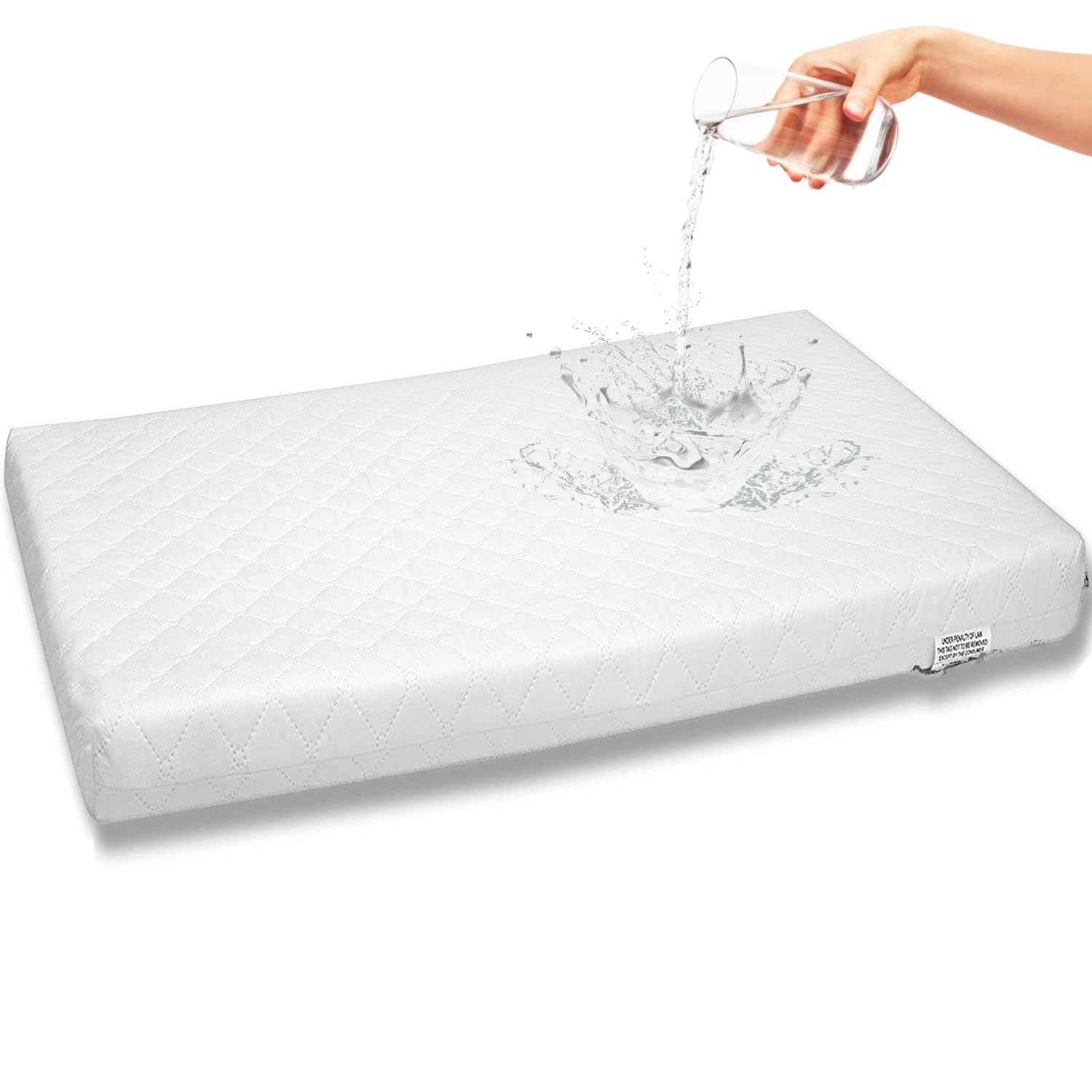First Essentials bassinet mattress pad 3-inch close-up shows supportive surface.