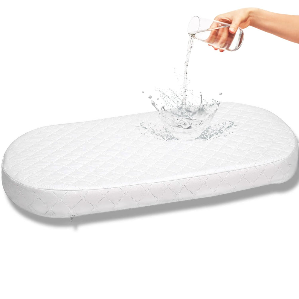 First Essentials bassinet mattress pad oval top view shows a safe sleeping surface