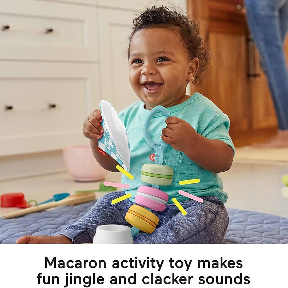 Fisher-Price Baby Bakery Treats macaron toy ribbons for engaging sensory exploration.